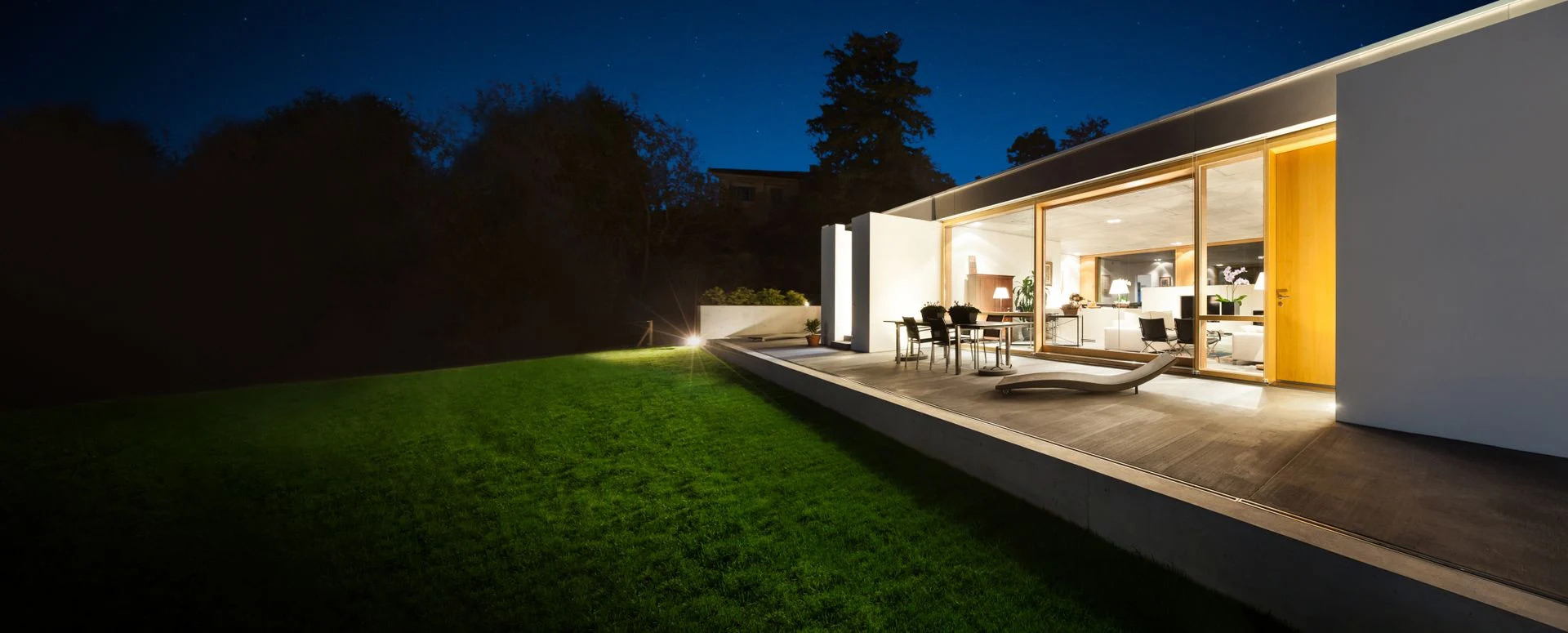 A modern luxury home exterior at dusk