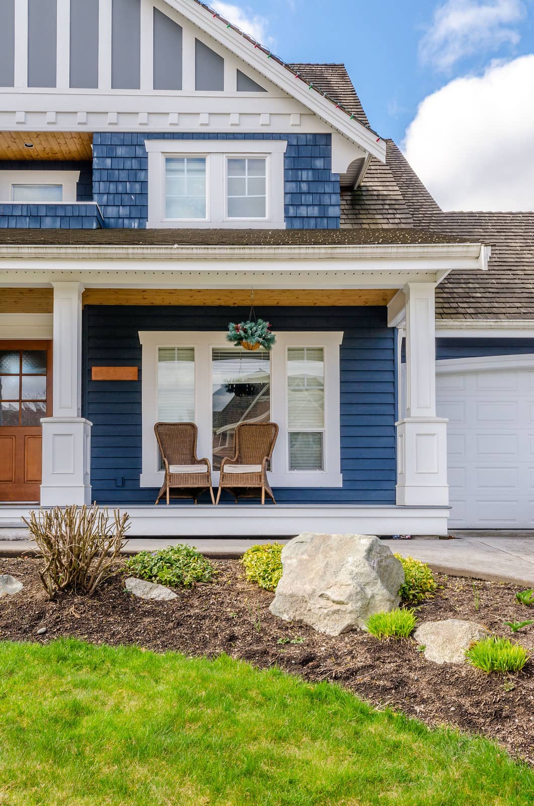 A residential front porch and home exterior in a quiet neighborhood