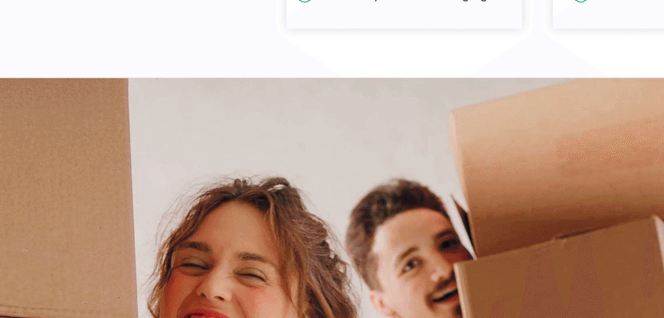 A happy Utah couple carrying moving boxes after selling their house for cash